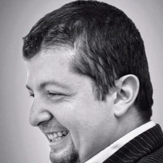 Cal Lopez, author of The Ascension Directive, smiling at the camera